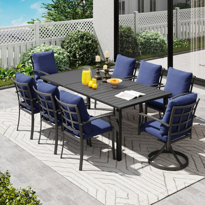 Ensemble de salle à manger en métal noir 9 pièces avec table rectangulaire, 2 chaises pivotantes et coussins bleus Maynard