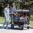 Jeep Wrangler Deluxe 4 Seater Stroller Wagon by Delta Children - Premium Stroller Wagon for 4 Kids with Convertible Seats, Adjustable Push/Pull Handles, Removable Canopy & Flat Fold