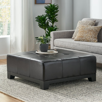 Afsheen Faux Leather Ottoman