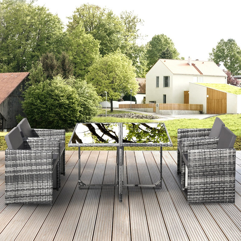 Abihail 4 - Person Patio Dining Set Rectangular Table with Cushions Included