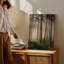 Toile «A Tranquil Forest Scene Bathed In Soft Golden Morning Light», art mural mettant en vedette de grands pins élancés avec écorce texturée-1066791654