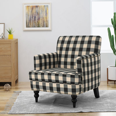 Confortable fauteuil club capitonné pour un décor et une détente élégants