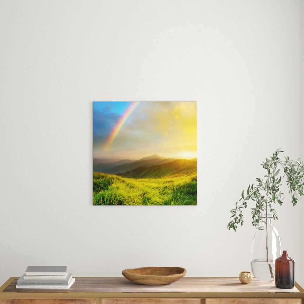 Leinwandbild Wunderschöne Berge mit Regenbogen am Himmel