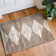 Tapis beige à rayures géométriques brunes