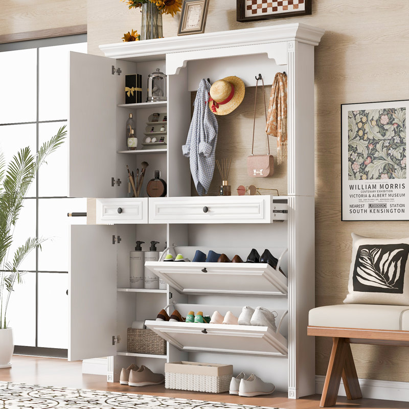 Portemanteau blanc avec armoire à chaussures, crochets et armoire à miroir, convient à l'entrée.