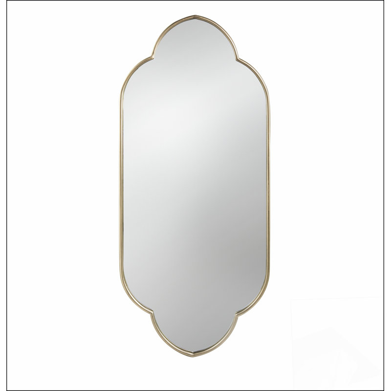 Miroir mural champagne doré avec bords entaillés, parfait pour améliorer l'esthétique et la luminosité de la pièce