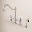 Kingston Brass Heritage Two-Handle 4-Hole Deck Mount Bridge Kitchen Faucet with Brass Side Sprayer