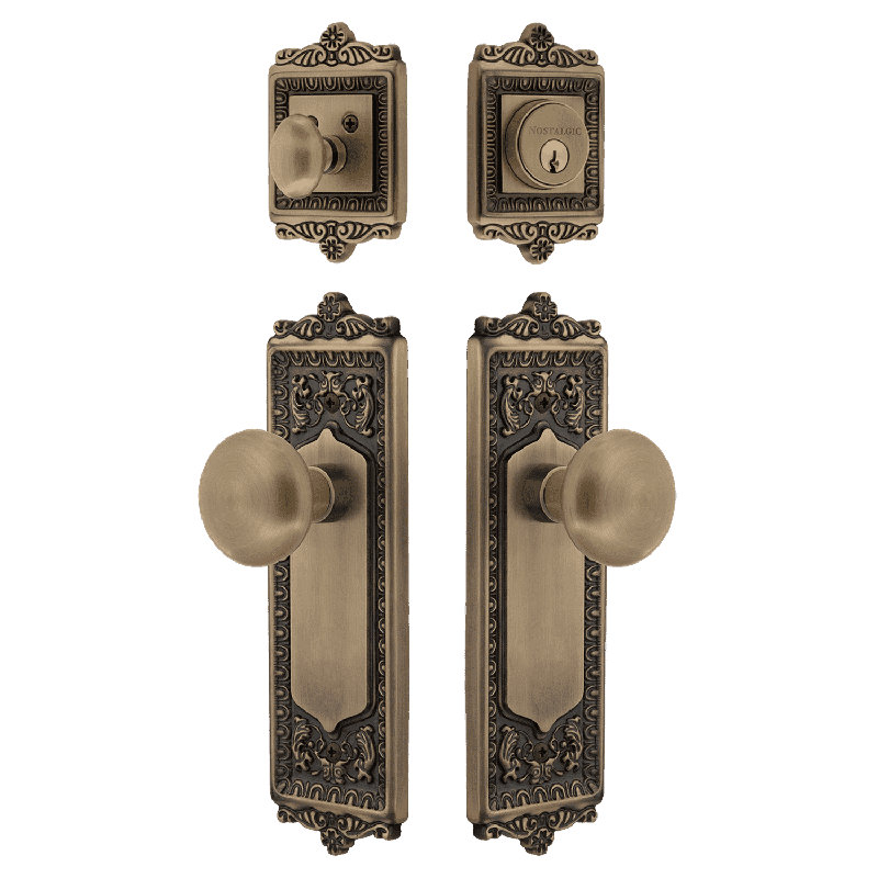 Nostalgic Warehouse Egg & Dart Entry Set with Porcelain Knob, Antique Brass, 2.75