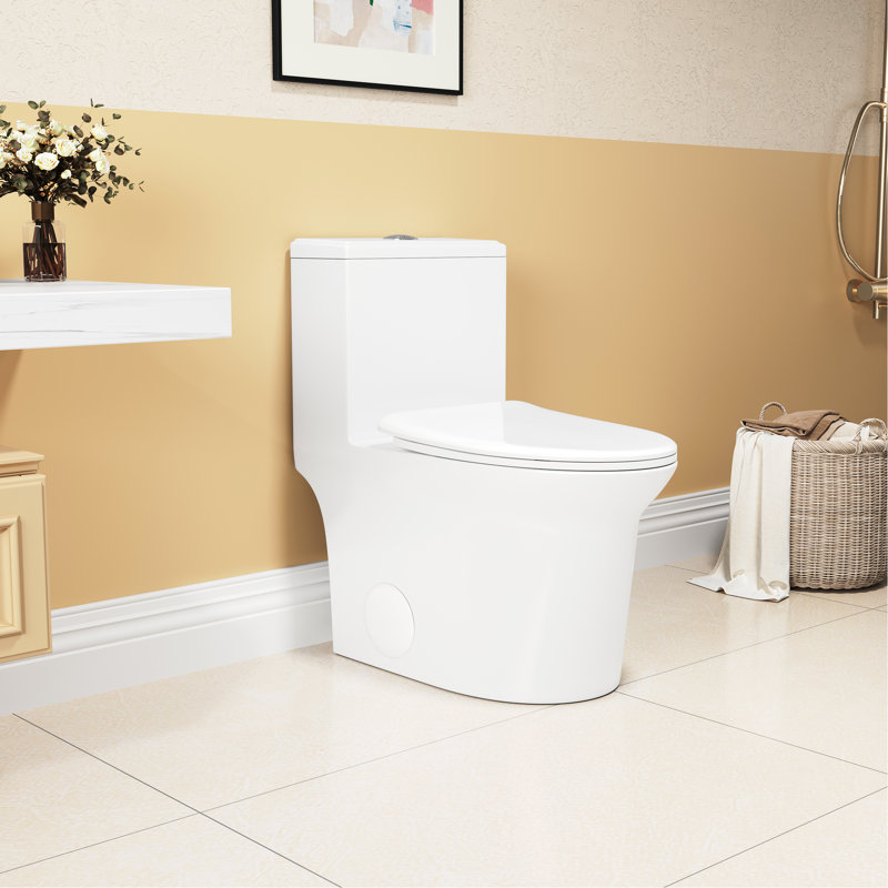 Une toilette en céramique, chasse d'eau 1,1 / 1,6, hauteur de confort de 15,55 po, siège à fermeture douce blanc et