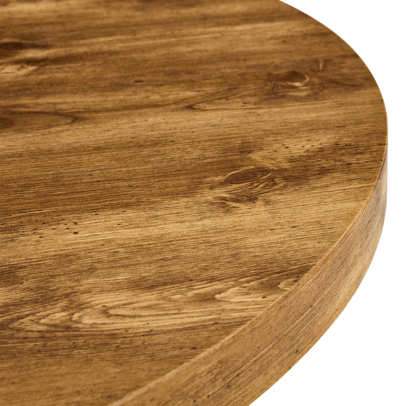Une table de salle à manger circulaire moderne et pratique. Fabriqué en bois aggloméré et en bois.