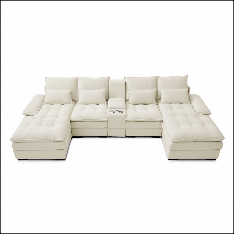 Canapé-lit spacieux en forme de U avec console intégrée, porte-gobelets, ports USB et méridienne.