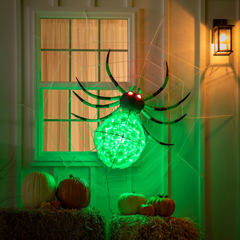 Araignée lumineuse sur toile d'Halloween illuminée