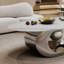 Table basse en marbre avec base sculpturale en acier inoxydable