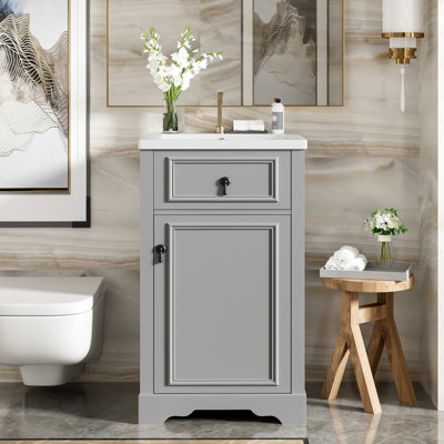 Meuble-lavabo de 20 pouces avec lavabo en céramique, porte à fermeture en douceur et tablette réglable pour un accès facile à la plomberie dans les salles de bain