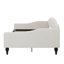 A Full-Size Upholstered Daybed With Tufted Detailing