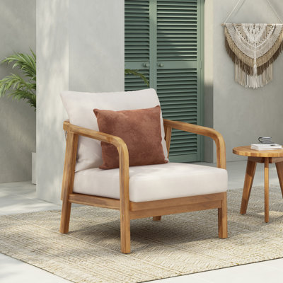 Chaise à structure en bois avec coussin moelleux et accoudoirs courbés