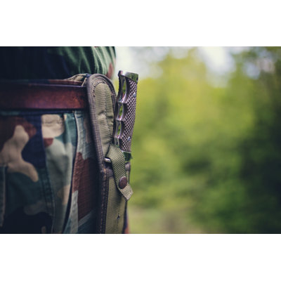 Hunting survival knife carried by a man on his belt Wall Art on Canvas
