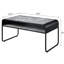 Table basse moderne en béton gris et noir avec tablette et base en métal pour le salon