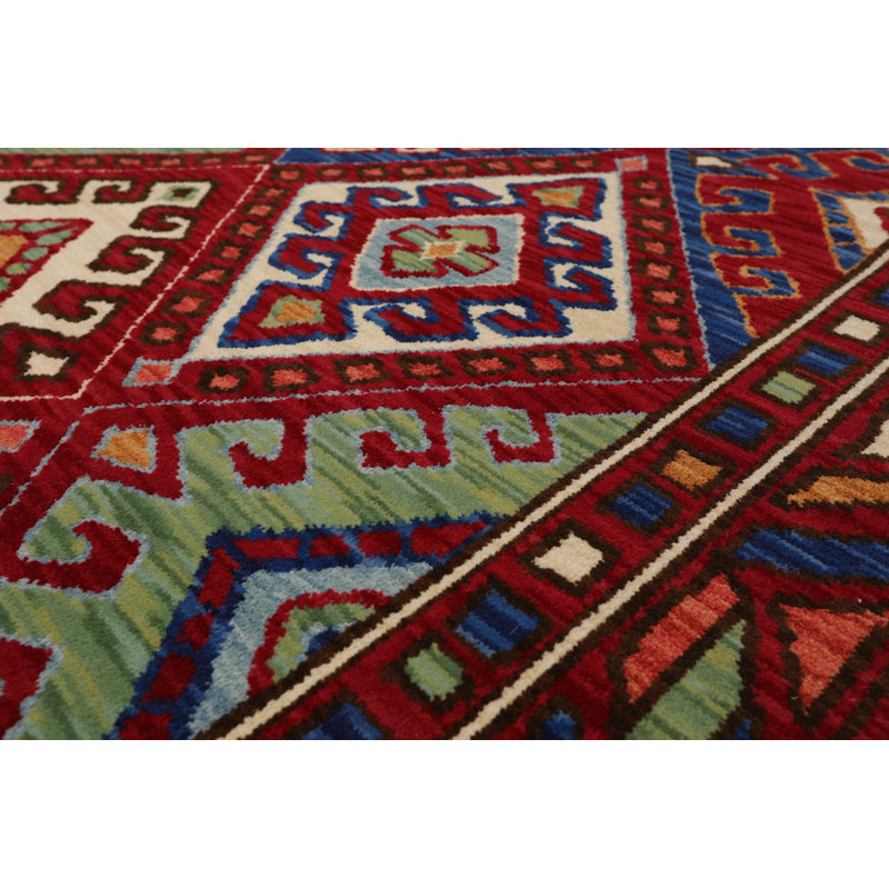 Tapis rouge géométrique en laine bouclé