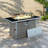 Propane Gas Fire Pit Table With Glass Wind Guard And An Open Basket-wave Patterned Wicker-1240792518