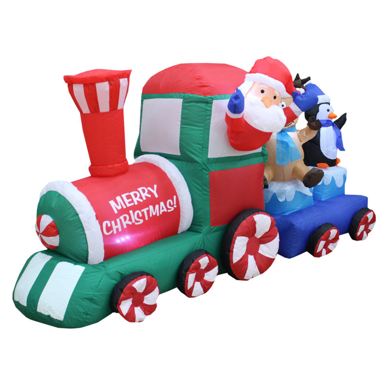 Père Noël dans un train gonflable de Noël
