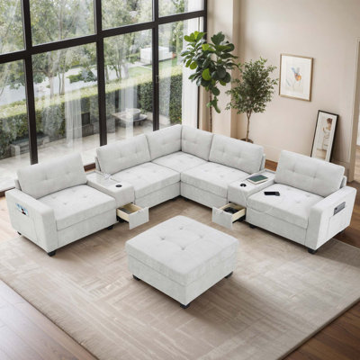 Canapé modulaire en chenille avec repose-pieds mobile et stations de charge intégrées