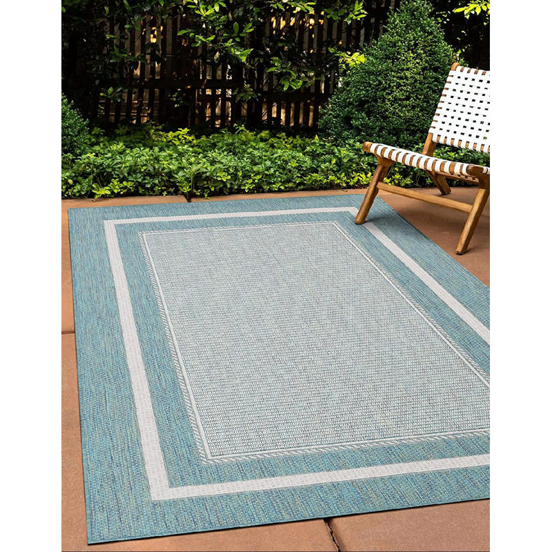 Tapis intérieur / extérieur gris / bleu clair en polypropylène Alxavier