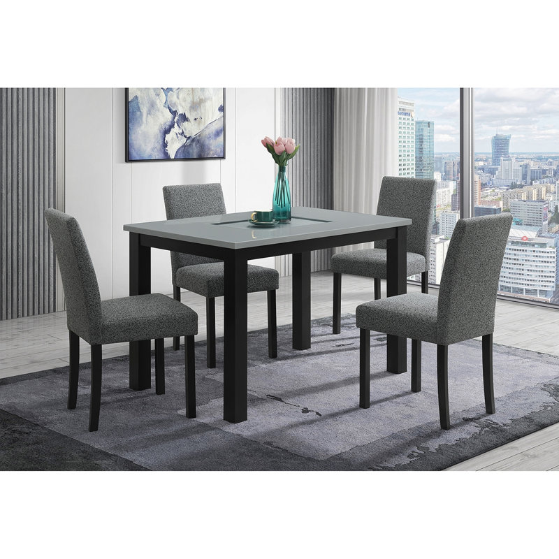 Table de salle à manger grise et noire avec ensemble de chaises