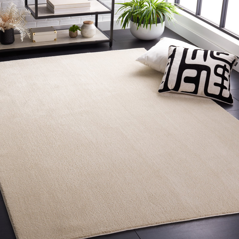 Anabeatriz Solid Color Handwoven Polyester Area Rug in Ivory, Rectangle 5'3" x 7'7"