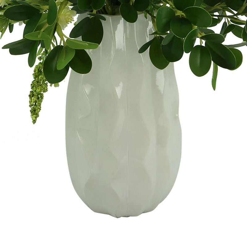 Budding Hydrangeas and Boxwoods Arranged in a Ceramic Vase