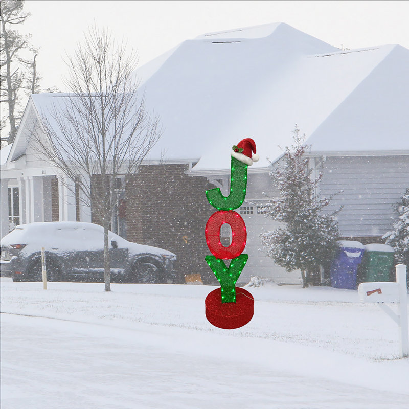 Figurine "JOY" avec chapeau de père Noël