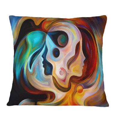 Coussin décoratif bleu, orange et rouge