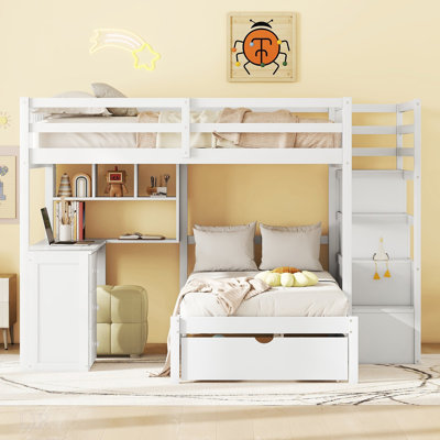 Lit superposé double au-dessus de simple avec bureau, tiroirs et tablettes pour un espace de vie compact et organisé