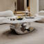Table basse en marbre avec base sculpturale en acier inoxydable-493155572