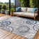 Chartier Machine Woven Floral Area Rug