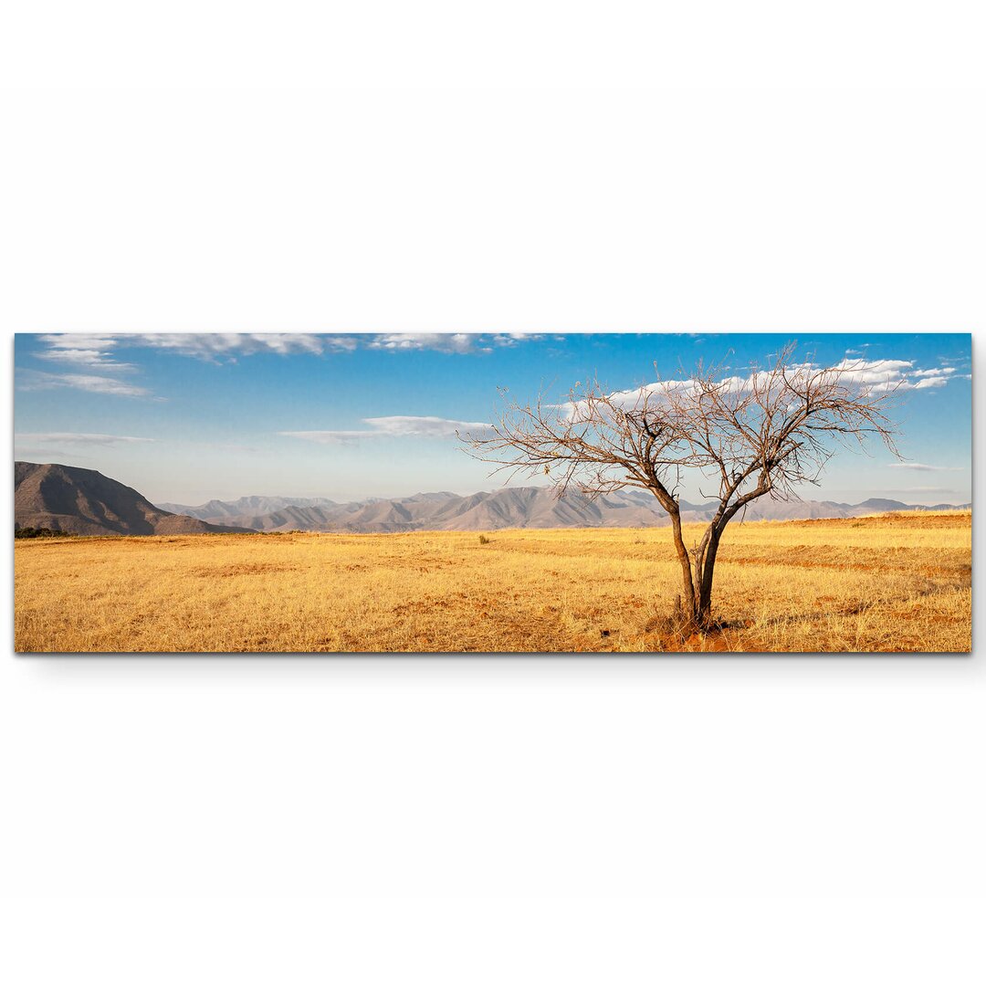 Leinwandbild Kahler Baum in der afrikanischen Savanne