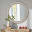 Miroir mural rond avec bordure perlée