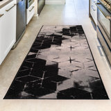 Broschard Geometric Tufted Black Area Rug