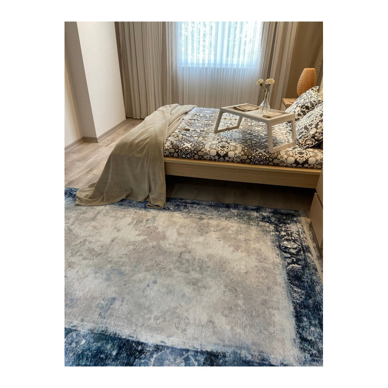 Tapis bleu lavable à motif frangé classique