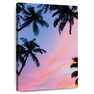 Coucher de soleil coloré au-dessus de palmiers Harnek