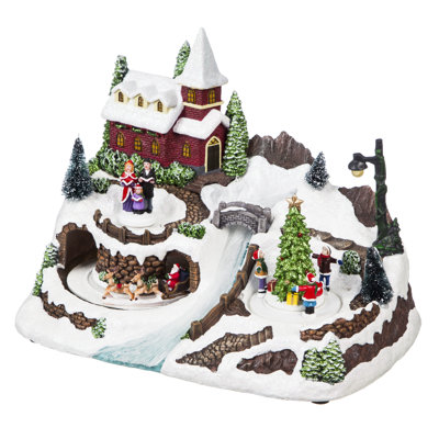 Scène d'un village enneigé à Noël avec rivière à DEL