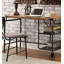 Bureau d'inspiration industrielle avec un plateau en bois noir antique et des roulettes décoratives