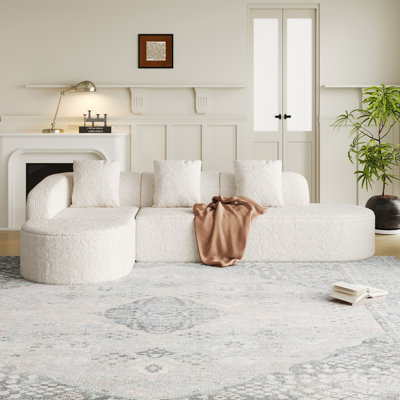 Canapé modulaire incurvé en L de 111,8 po avec tissu en polyester texturé litchi et trois coussins pour un confort moderne