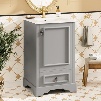 Meuble-lavabo de 20 pouces avec fabrication en bois massif, panneaux de porte et système de fermeture en douceur pour une utilisation durable, un cadre peu encombrant, une porte et une tablette de rangement réglable