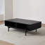 Table basse noire sculptée-110476767