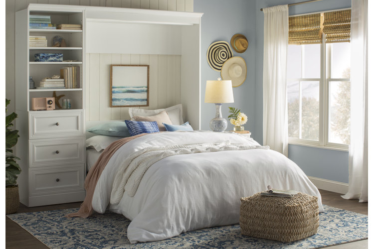 coastal guest bedroom with a white Murphy bed and coastal decor