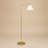 Brass Ring Base Floor Lamp with Triangle White Drum Shade