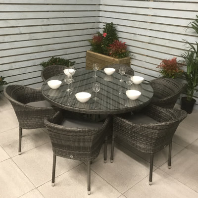 Lilia 6 - Person Wicker Patio Dining Set with Round Table , Cushions Included