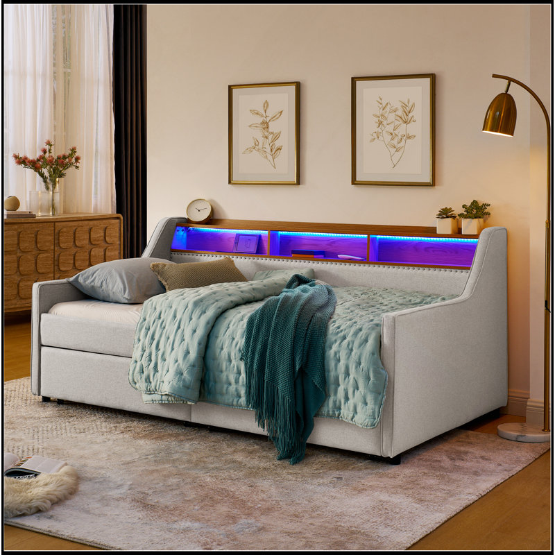 Canapé-lit polyvalent avec lumières DEL, recharge sans fil et grand espace de rangement pour un espace de vie élégant et fonctionnel.