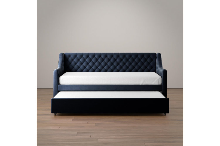 The navy Antonia upholstered twin daybed with trundle.